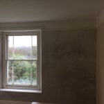 Plastering a bedroom wall